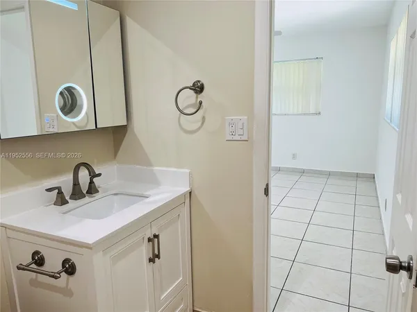 a bathroom with a sink and a mirror