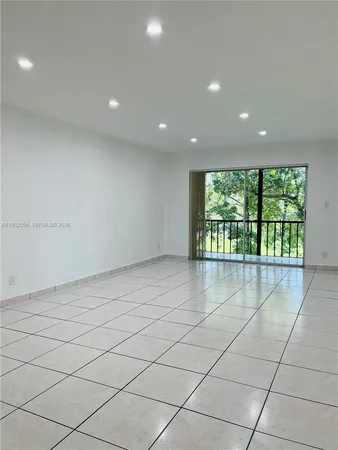 a view of a livingroom with an empty space and a hallway