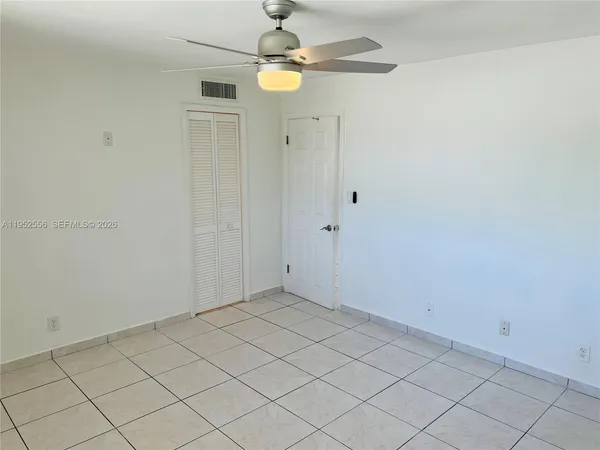an empty room with fan