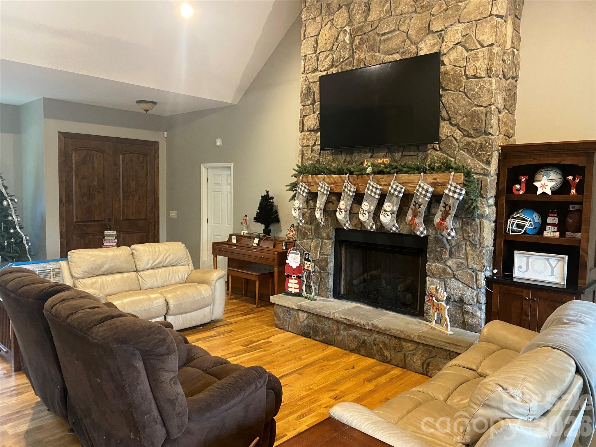 2818 Rockford Road Shelby, NC 28152 - Photo 7 of 33 a living room with furniture a flat screen tv and a fireplace