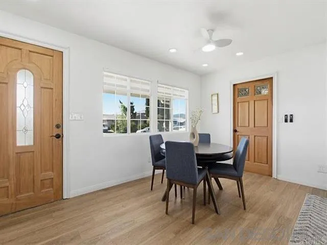 9462 Doheny Road Santee, CA 92071 - Photo 3 of 33 a view of a dining room with furniture window and wooden floor