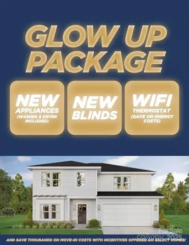 a front view of a building with a bunch of traffic and flowers