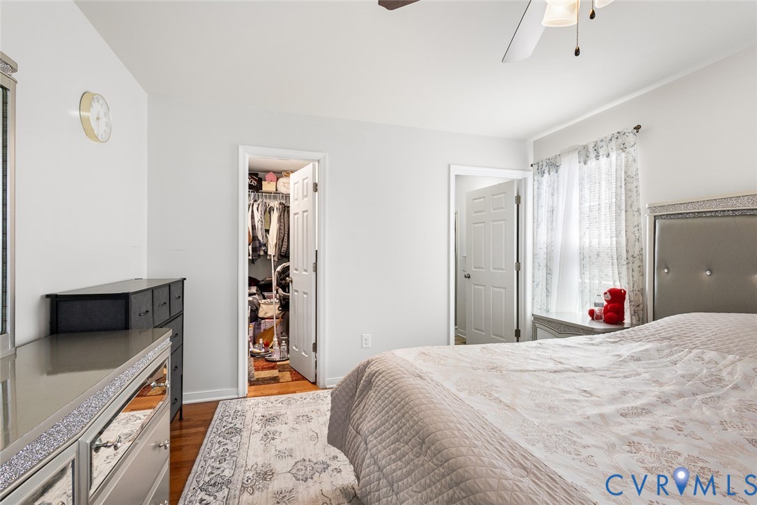 10155 Virginia Road Glen Allen, VA 23060 - Photo 14 of 34 Bedroom featuring dark wood-style flooring, a walk