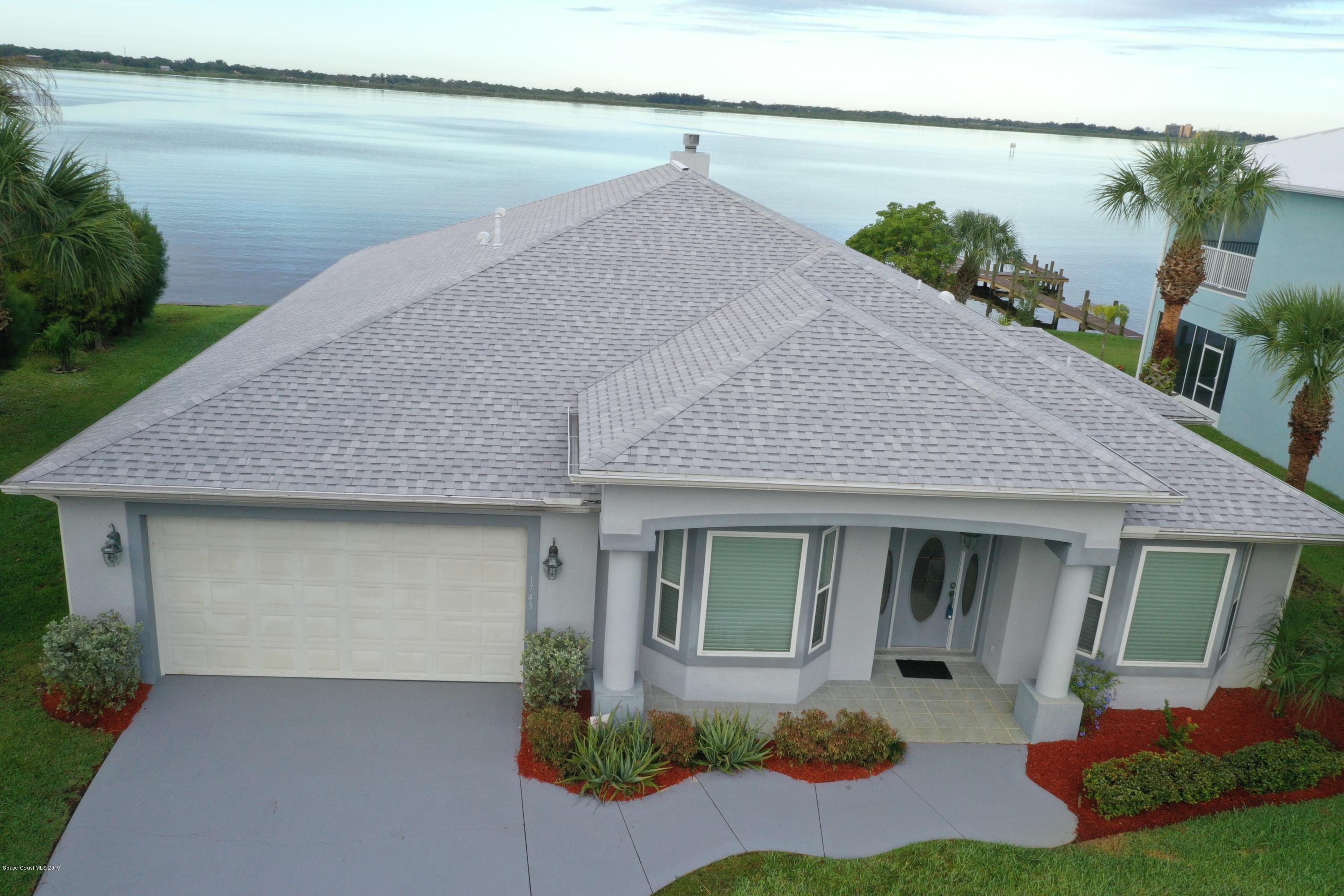 1745 Vía Roma Merritt Island, FL 32952 - Photo 2 of 32 Aerial Front