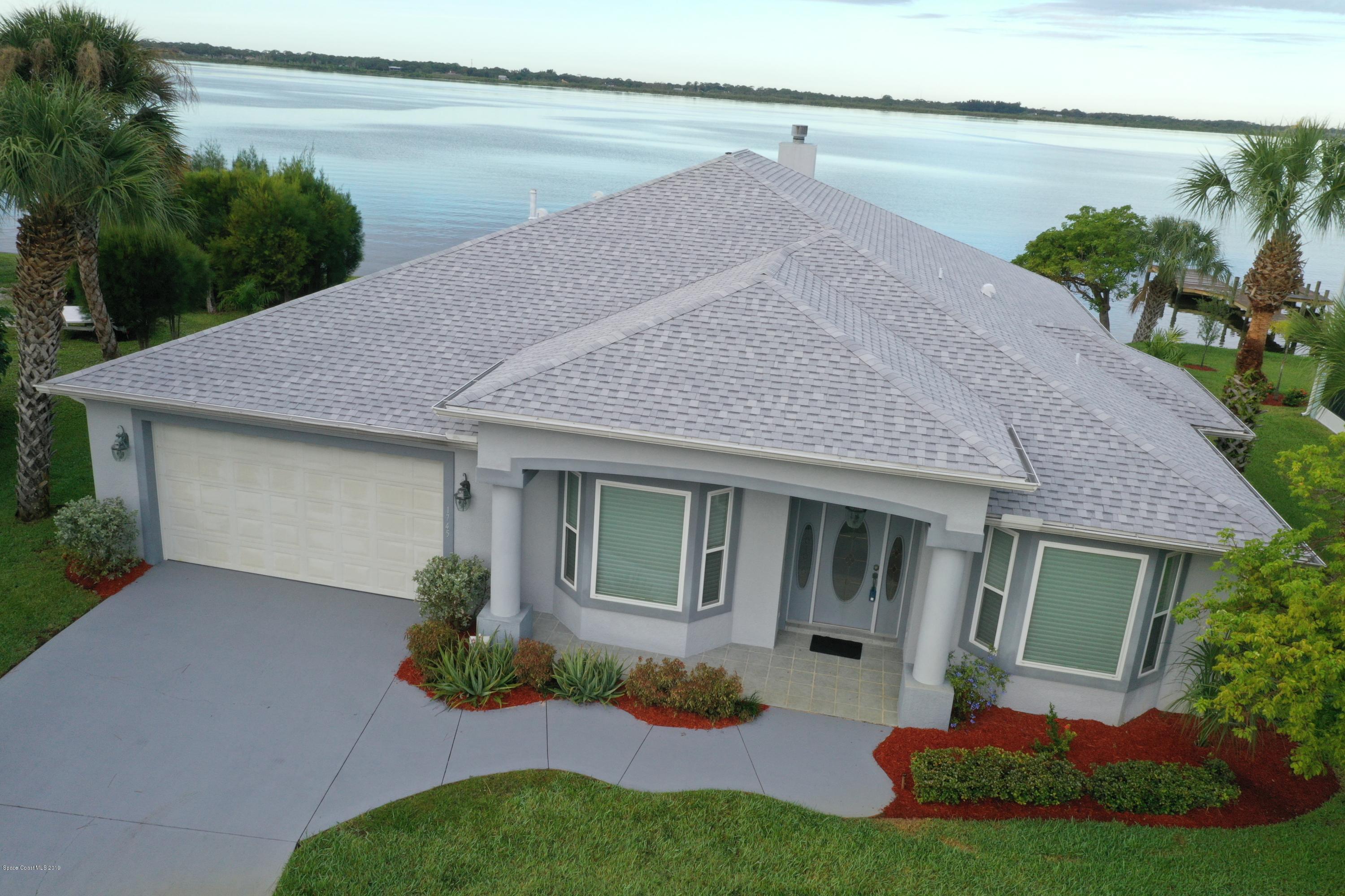 1745 Vía Roma Merritt Island, FL 32952 - Photo 5 of 32 Front Aerial