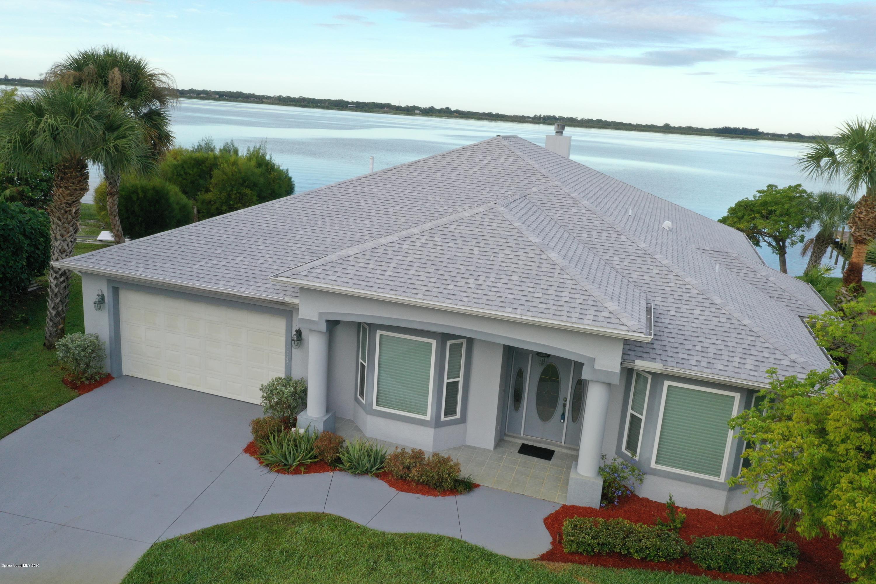 1745 Vía Roma Merritt Island, FL 32952 - Photo 6 of 32 Aerial Front