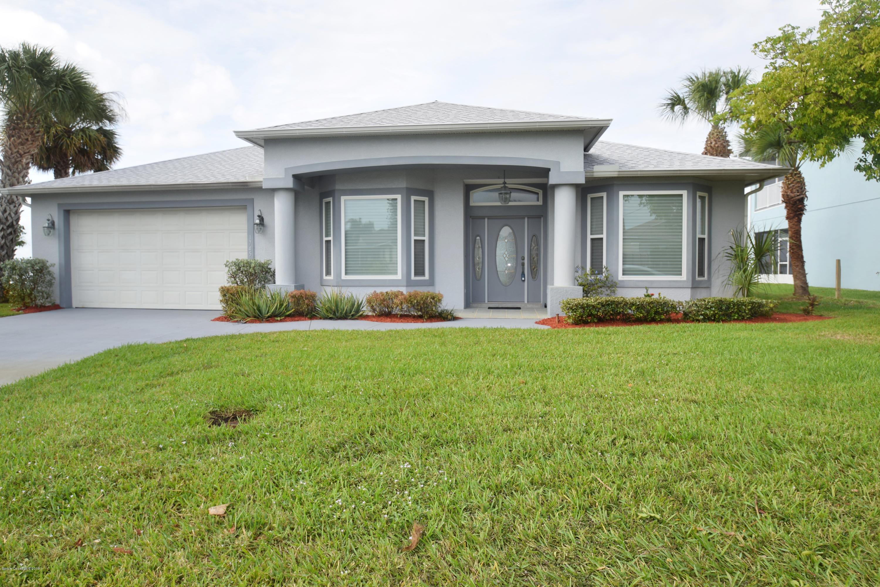 1745 Vía Roma Merritt Island, FL 32952 - Photo 7 of 32 Front