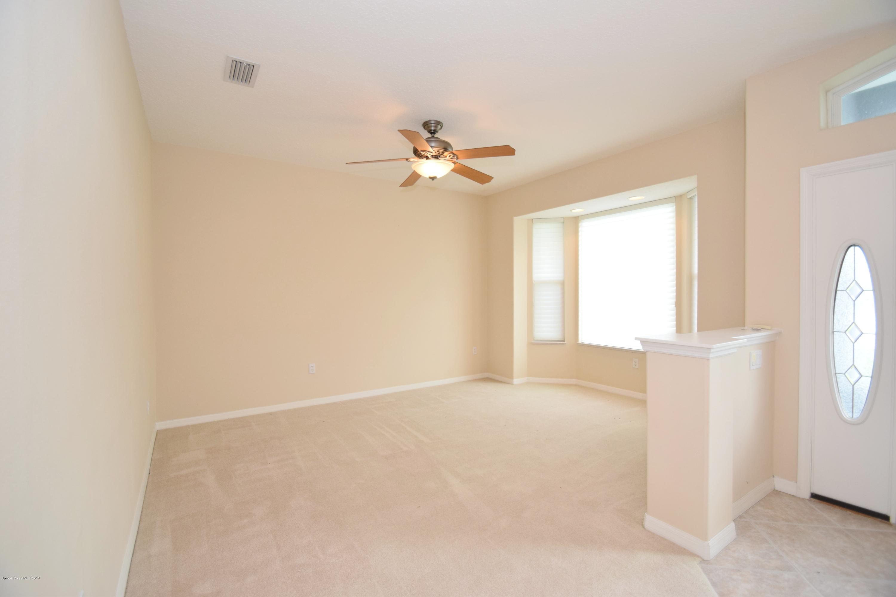 1745 Vía Roma Merritt Island, FL 32952 - Photo 8 of 32 Living Room