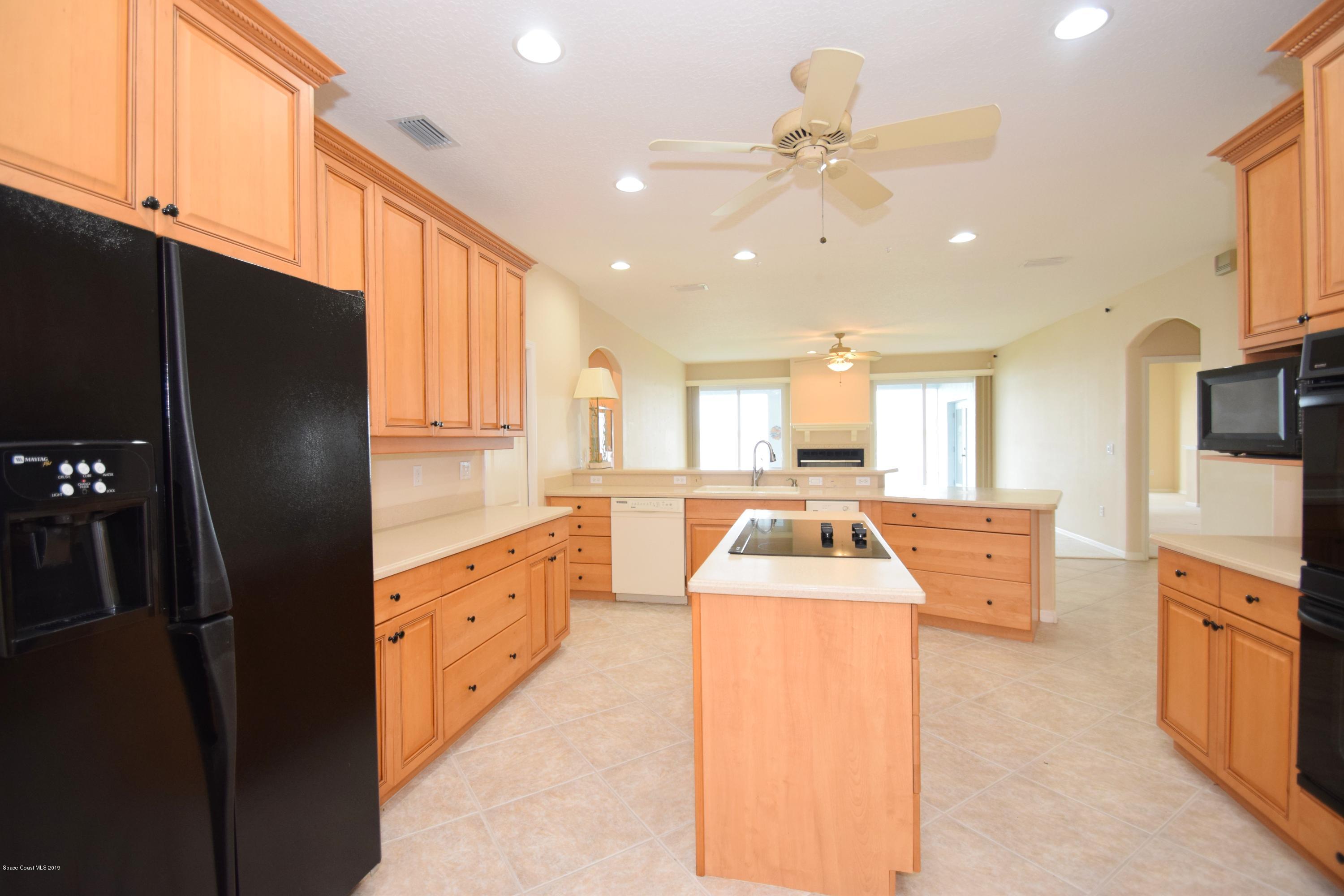1745 Vía Roma Merritt Island, FL 32952 - Photo 10 of 32 Island Kitchen