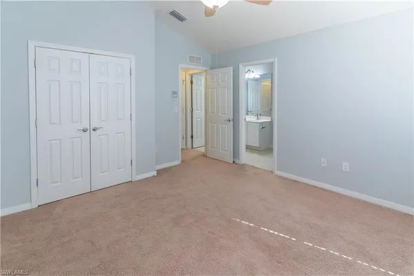 a view of an empty room with a bathroom
