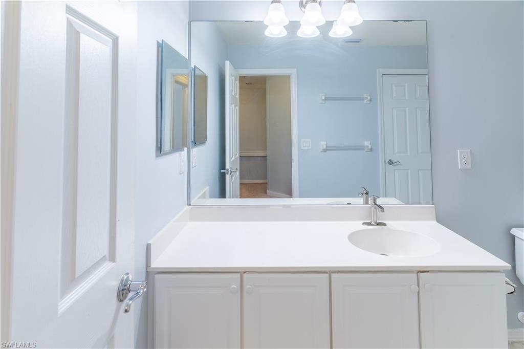 16146 Caldera Lane, Unit 31 Naples, FL 34110 - Photo 17 of 35 a bathroom with a sink and a mirror
