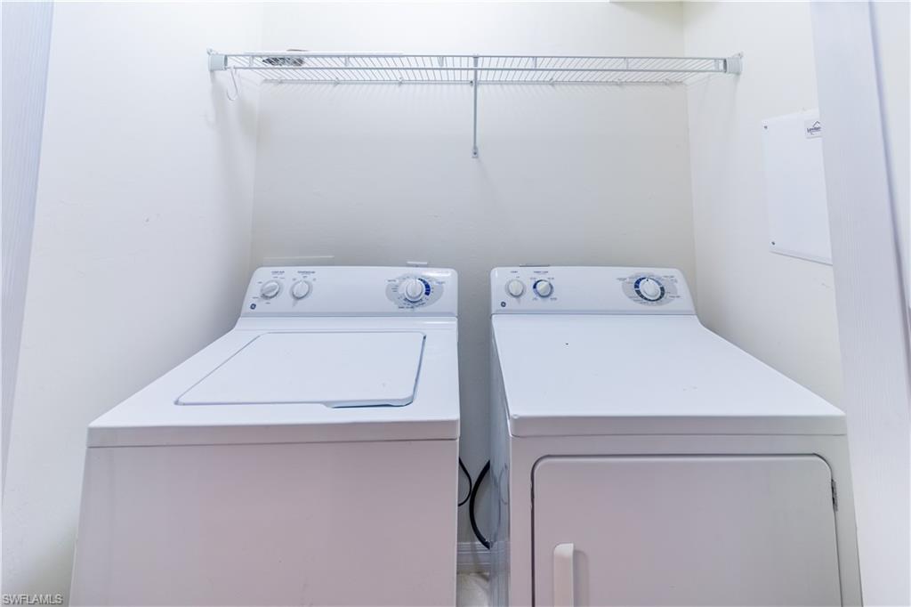 16146 Caldera Lane, Unit 31 Naples, FL 34110 - Photo 20 of 35 a utility room with dryer and washer