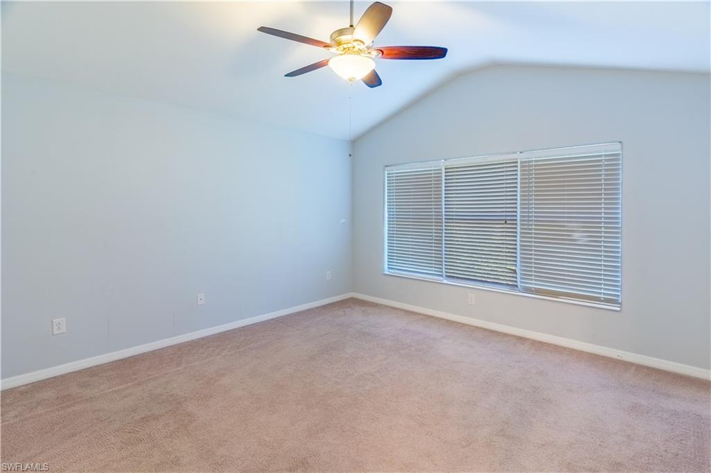 16146 Caldera Lane, Unit 31 Naples, FL 34110 - Photo 23 of 35 an empty room with windows and fan
