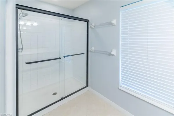 a white toilet sitting next to a white wall