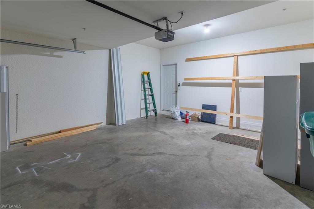 16146 Caldera Lane, Unit 31 Naples, FL 34110 - Photo 30 of 35 a view of a livingroom with a ceiling fan and refrigerator
