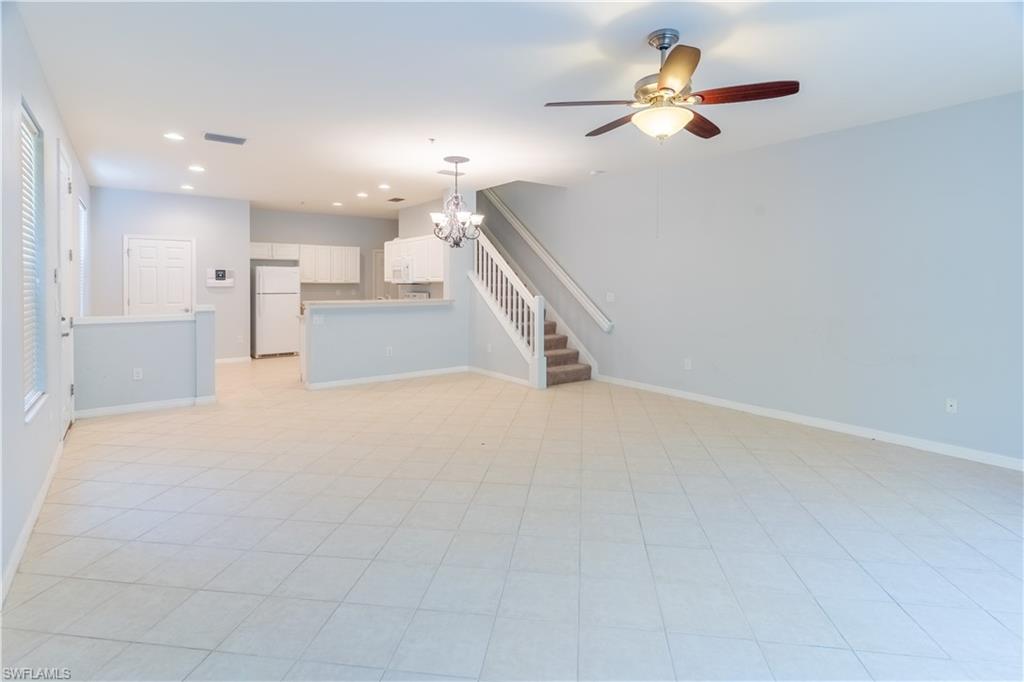 16146 Caldera Lane, Unit 31 Naples, FL 34110 - Photo 5 of 35 a view of an empty room with kitchen and kitchen view