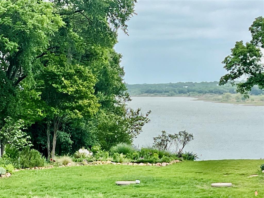 309 Broken Arrow Comanche, TX 76442 - Photo 14 of 35 a view of a lake with a big yard