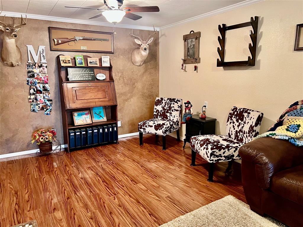 309 Broken Arrow Comanche, TX 76442 - Photo 17 of 35 a living room with furniture and a flat screen tv