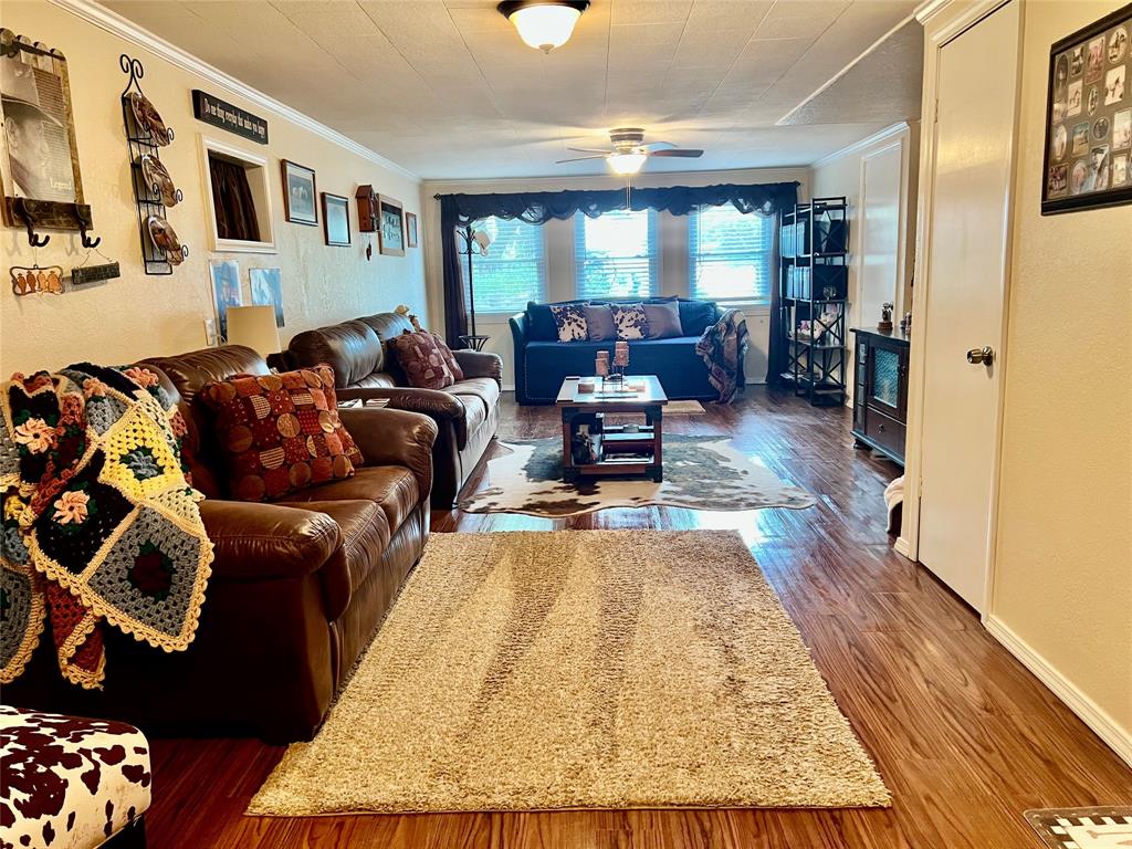 309 Broken Arrow Comanche, TX 76442 - Photo 18 of 35 a living room with furniture and a couch