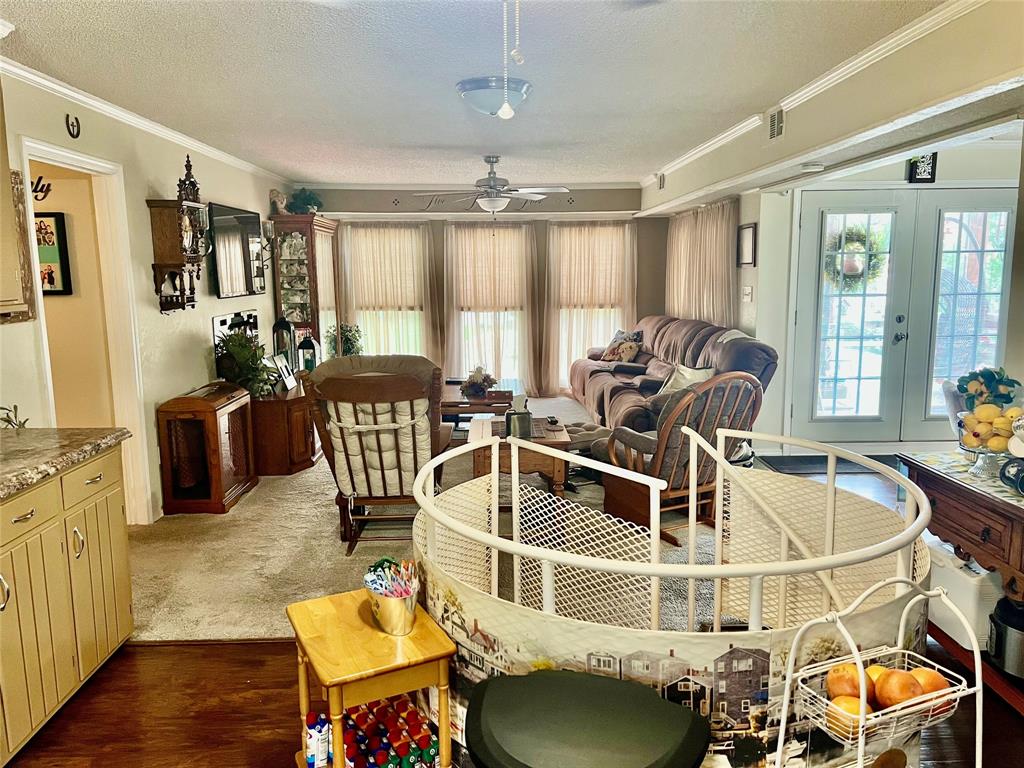 309 Broken Arrow Comanche, TX 76442 - Photo 19 of 35 a room with wooden floor pool table and windows