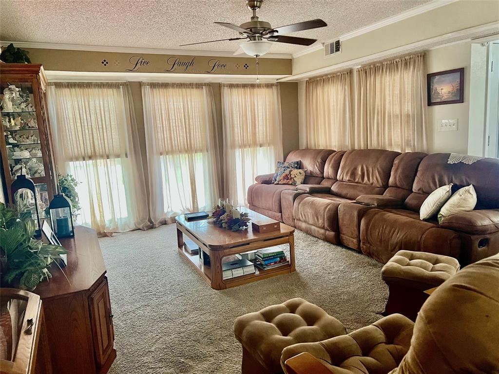 309 Broken Arrow Comanche, TX 76442 - Photo 20 of 35 a living room with furniture and a large window