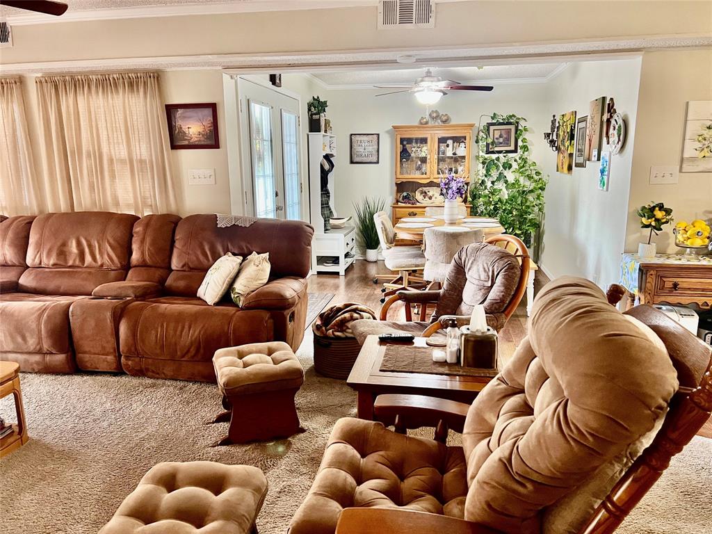 309 Broken Arrow Comanche, TX 76442 - Photo 22 of 35 a living room with furniture ceiling window and couch