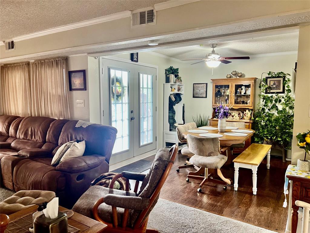 309 Broken Arrow Comanche, TX 76442 - Photo 25 of 35 a living room with furniture and wooden floor
