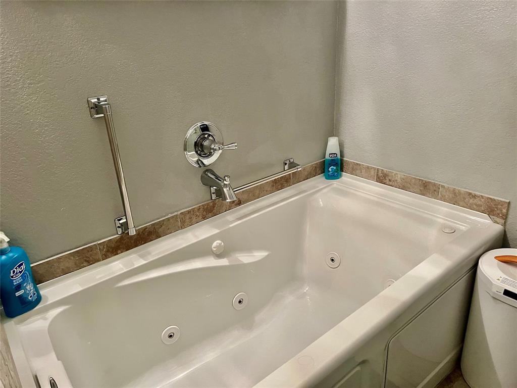 309 Broken Arrow Comanche, TX 76442 - Photo 28 of 35 a bathroom with a tub and a sink