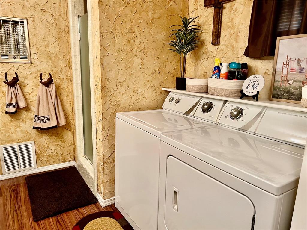 309 Broken Arrow Comanche, TX 76442 - Photo 33 of 35 a utility room with dryer and washer