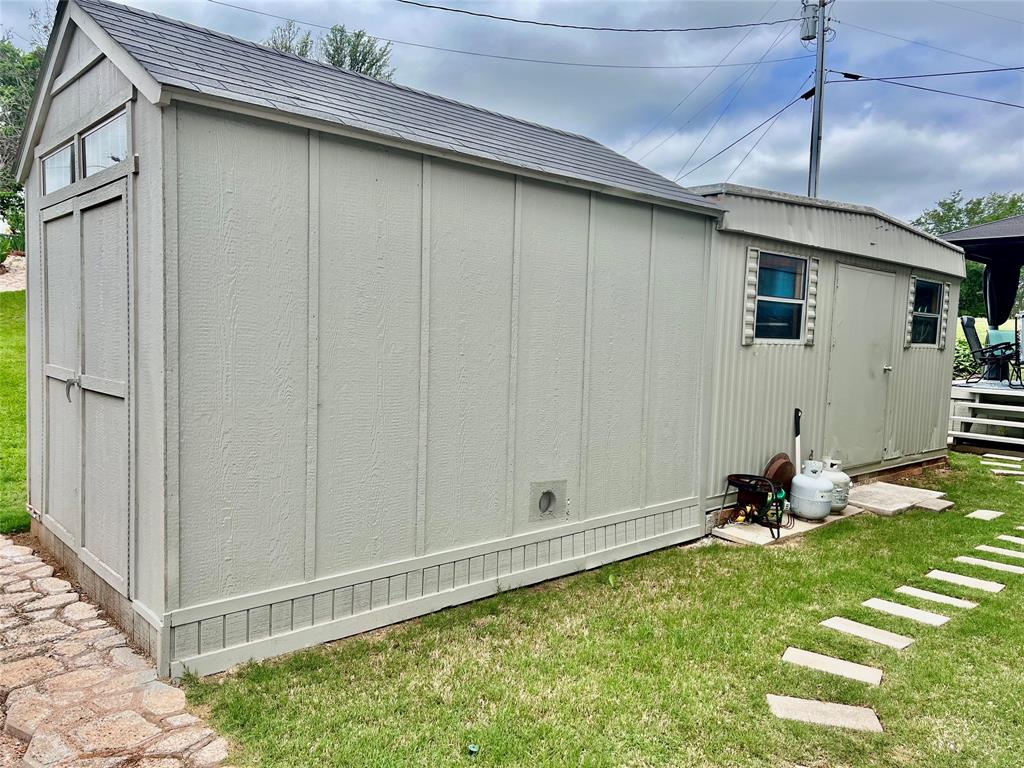 309 Broken Arrow Comanche, TX 76442 - Photo 9 of 35 a room with garden equipment