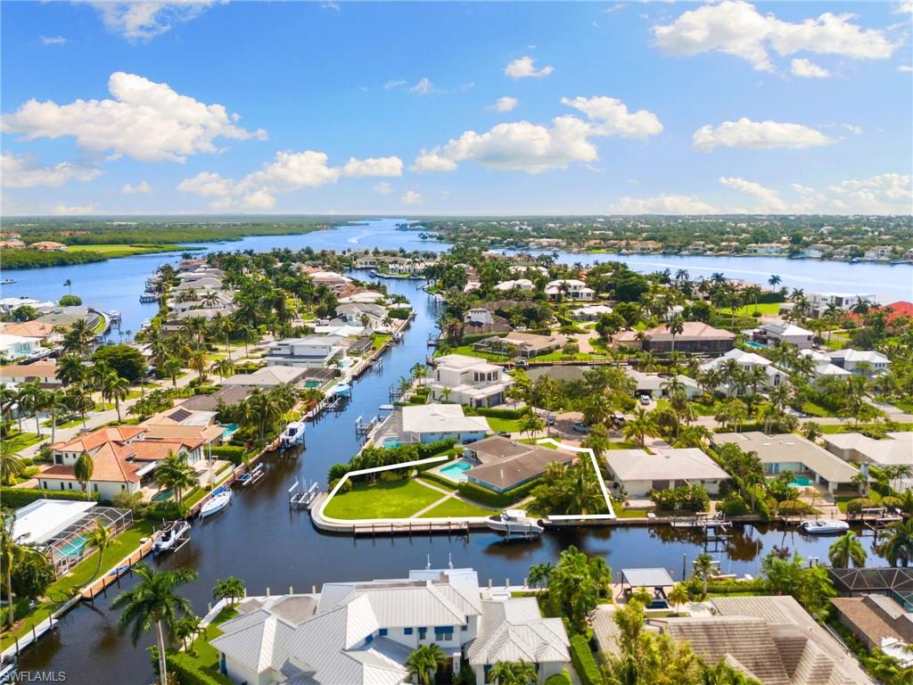 2140 Shad Court Naples, FL 34102 - Photo 13 of 44 an aerial view of residential houses with outdoor space