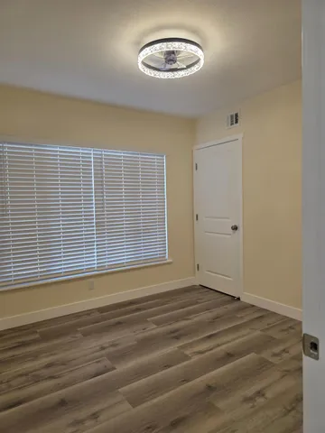 a view of an empty room with a window