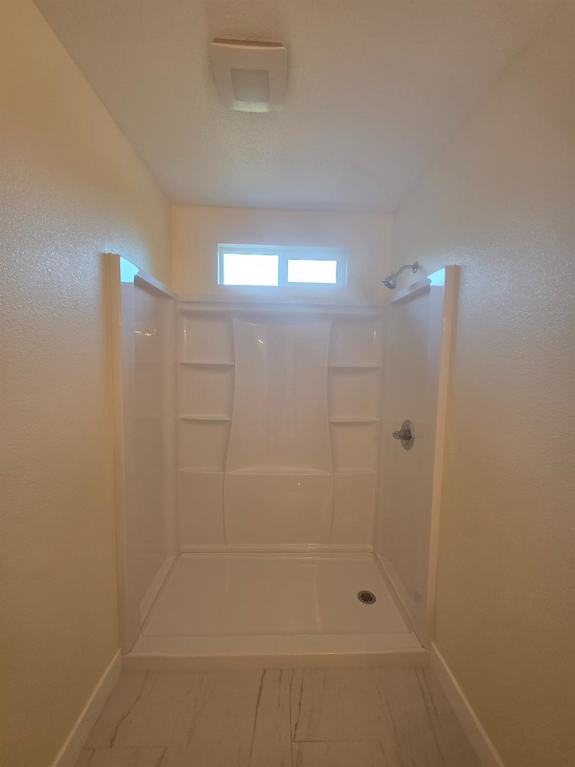 1098 East 21st Street Merced, CA 95340 - Photo 13 of 23 a bathroom with a shower
