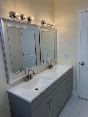 a bathroom with a sink and a mirror