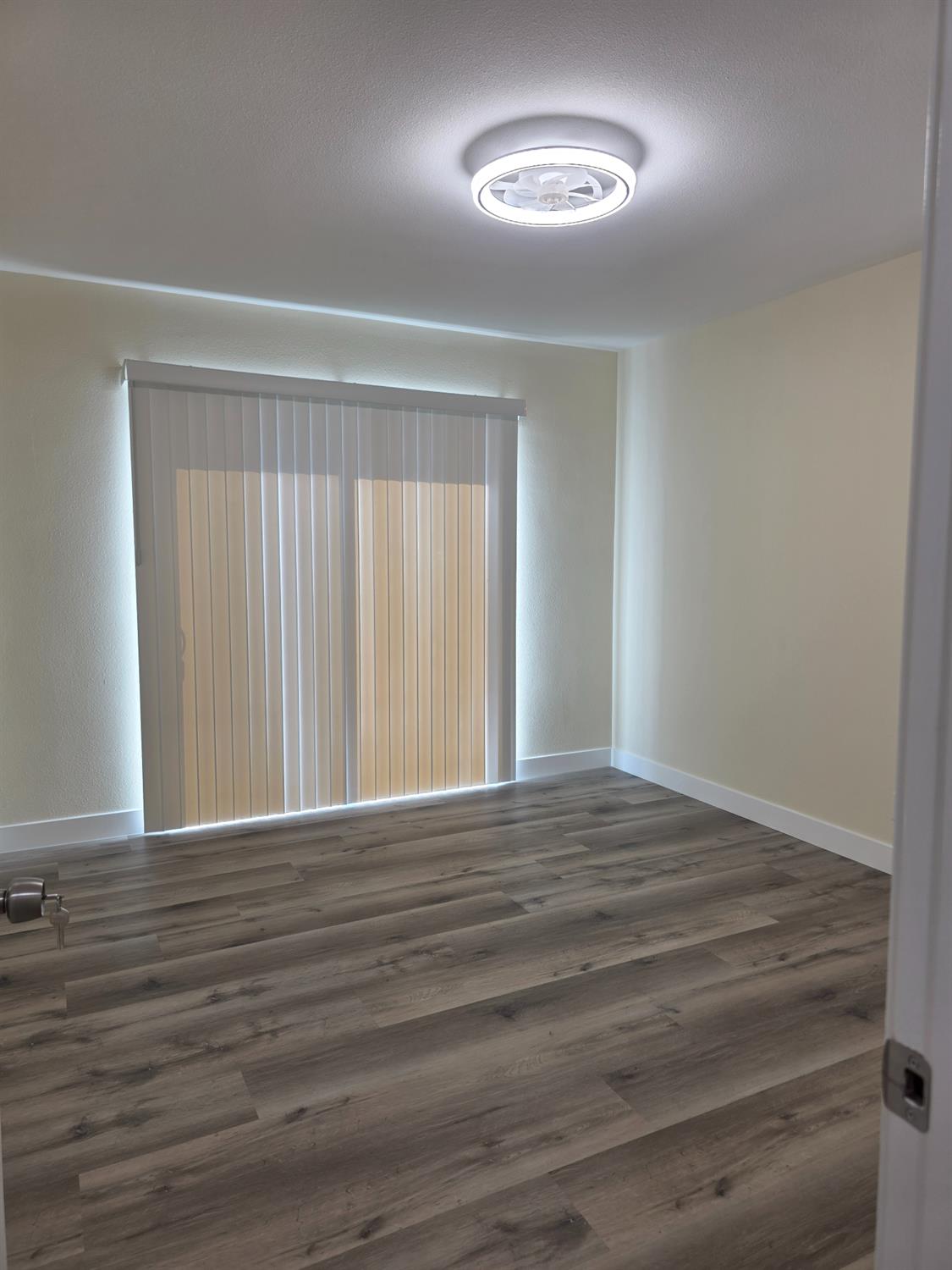 1098 East 21st Street Merced, CA 95340 - Photo 17 of 23 a view of an empty room with a window