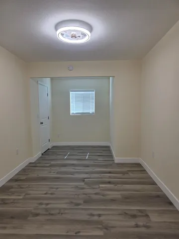 a view of an empty room with a window