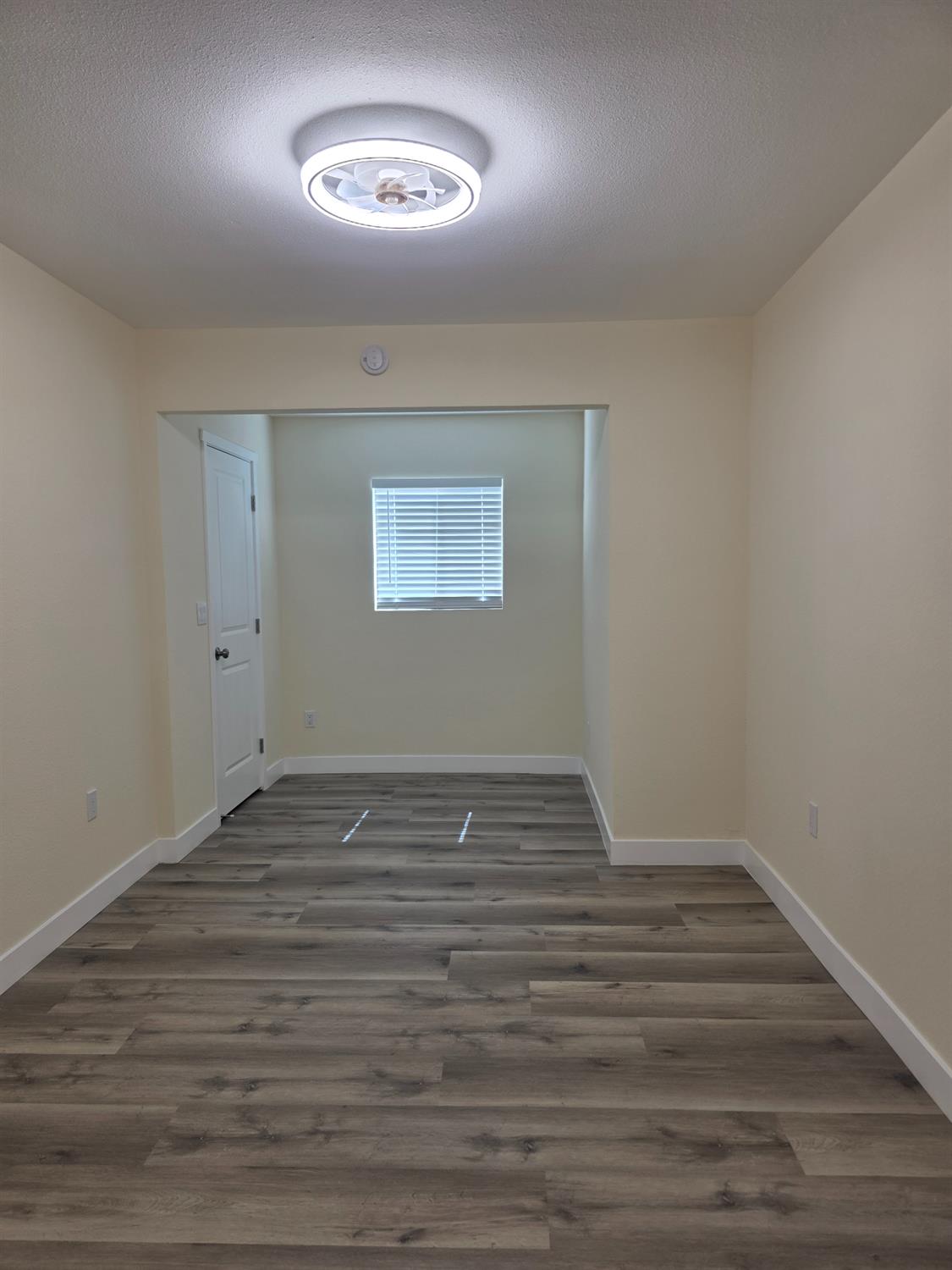 1098 East 21st Street Merced, CA 95340 - Photo 18 of 23 a view of an empty room with a window