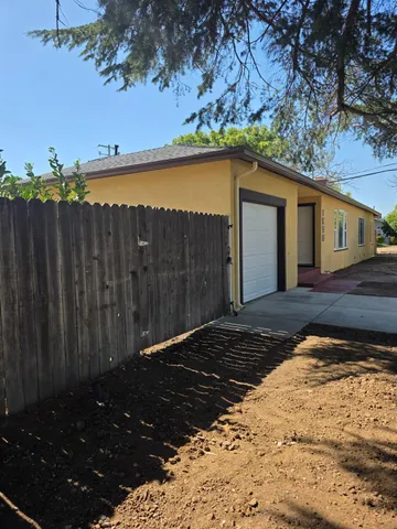 a view of a backyard of the house