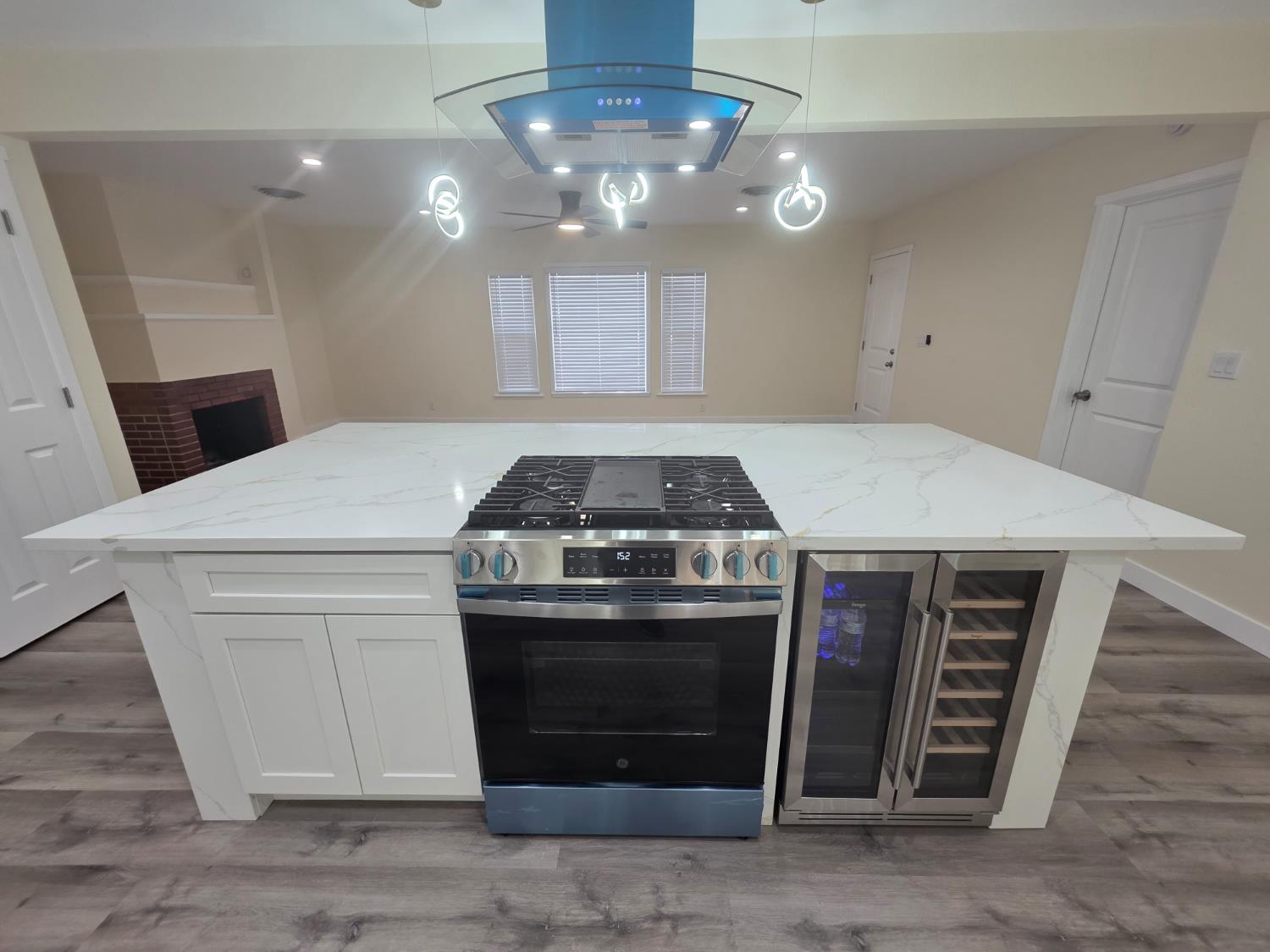 1098 East 21st Street Merced, CA 95340 - Photo 10 of 23 a stove top oven sitting inside of a kitchen