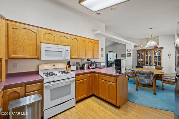 a utility room with wooden floor and cabinet