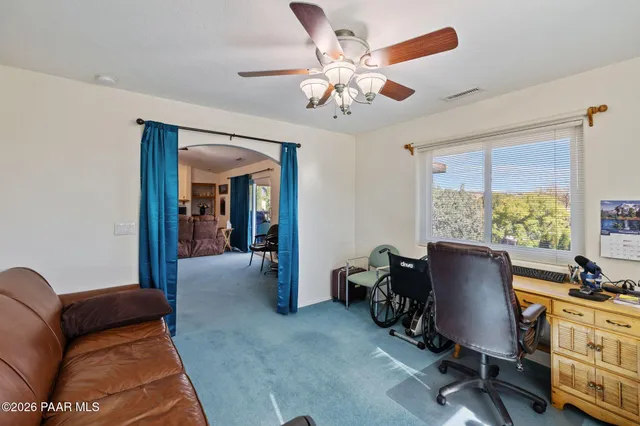 a bedroom with a bed dresser and a window