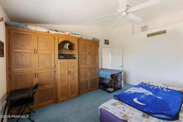 a bathroom with a tub double sink and mirror