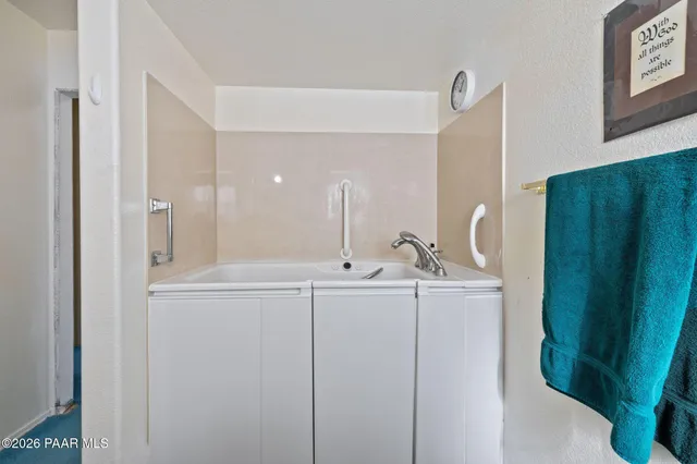 a view of a chairs and deck in the balcony