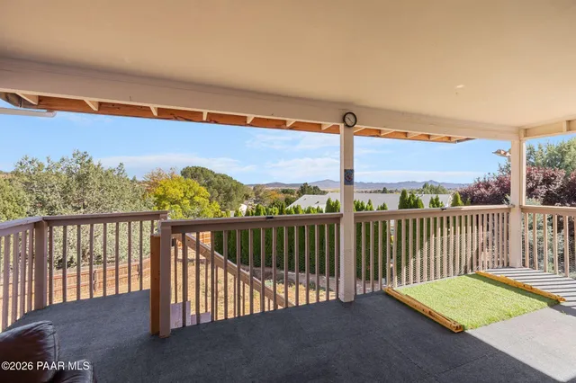 a living room with furniture and a garden