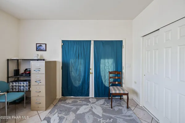 a living room with furniture ceiling fan and a wooden floor