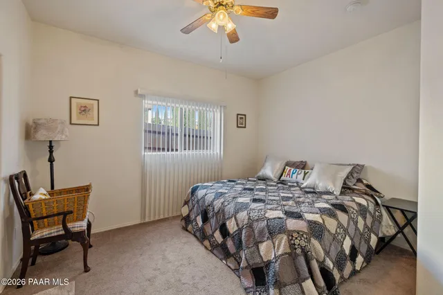 a wooden bench sitting in middle of a yard