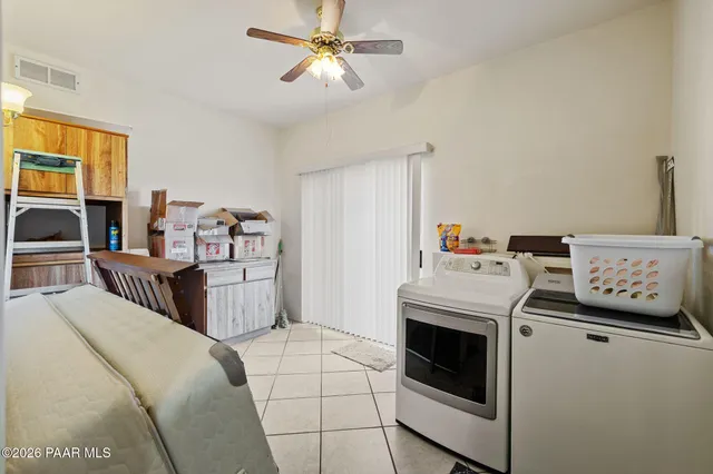 an aerial view of residential house with outdoor space and parking