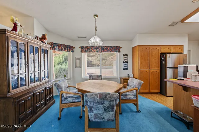 a dining room with furniture window wooden floor
