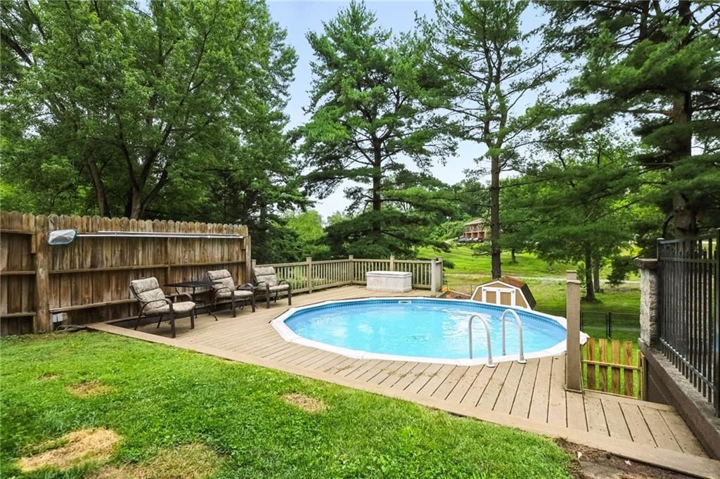 616 Highview Road Pittsburgh, PA 15234 - Photo 28 of 35 a view of a swimming pool with chairs and table in a yard