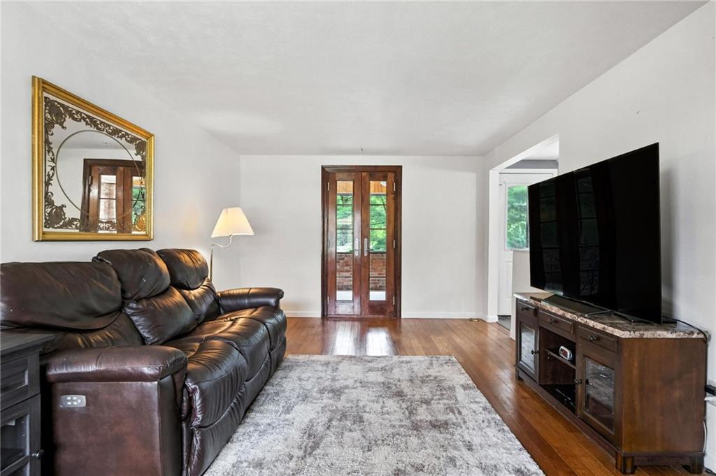 616 Highview Road Pittsburgh, PA 15234 - Photo 7 of 35 a living room with furniture and a flat screen tv